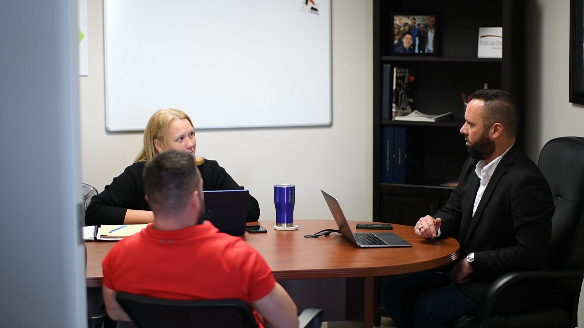 A business team meeting around a conference table